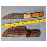 Serrated straight blade knife w/thumb rest.