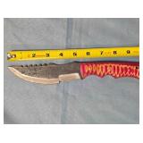 Straight serrated blade knife. Damascus steel.