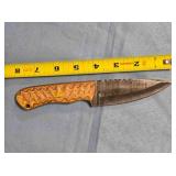 Drop point knife w/jimping on spine.