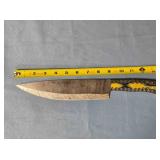 Drop point blade knife. Carved wood handle.