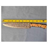 Drop point blade knife. Carved wood handle.