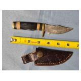 Trailing point blade knife w/jimping & guard.