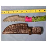 Straight blade knife w/serrated blade.