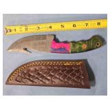 Trailing point knife w/gut hook.