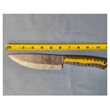 Drop point blade knife. Carved wood handle.