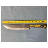 Straight blade knife. Carved wood handle.