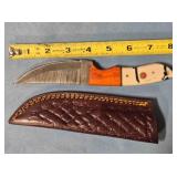 Trailing point knife. Wood & composite handle.