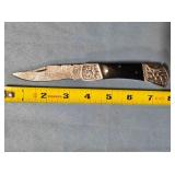 Lockback knife w/jimping on spine. Damascus steel.