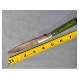 Drop point folding knife w/jimping spine.