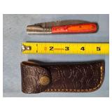 Folding knife w/jimping on spine. Damascus steel.