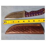 Drop point blade knife w/spine jimping.