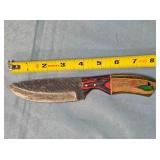 Drop point knife w/wood handle & thong hole.