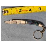 Folding knife w/keychain. Wood handle.