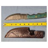 Straight blade knife with serrated spine.