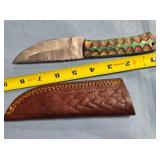 Straight blade knife w/jimping on spine.