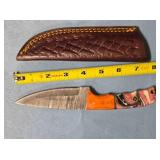 Drop point blade knife. Wood & composite handle.