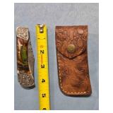 Bowie-style lockback knife w/jimping on spine.