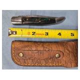 Folding Bowie-style blade knife. Composite handle.