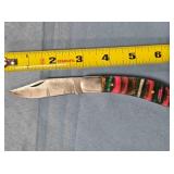 Folding Bowie-style blade knife. Composite handle.