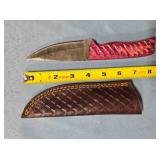 Drop point knife w/carved wood handle.