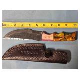 Trailing point knife. Wood & composite handle.