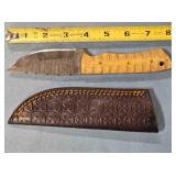 Straight blade knife. Carved wood handle.