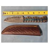 Drop point knife w/carved wood handle.