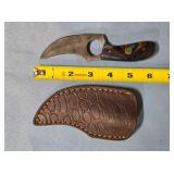 Trailing point knife w/spine jimping.