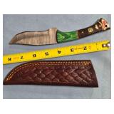 Clip point knife. composite/wood handle.