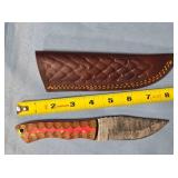 Clip point knife w/jimping on spine.