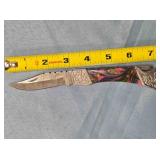 Lockback folding pocket knife w/Bowie-style blade.