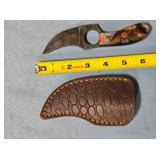 Trailing point knife w/finger hole.