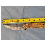 Trailing point knife w/jimping on blade.