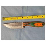 Drop point knife w/jimping on spine.