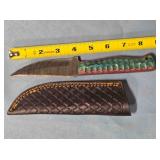 Trailing point knife. 8" length. Damascus steel.