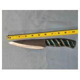 Drop point blade knife. Carved wood handle.