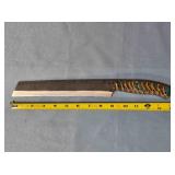 Serrated blade bread knife. Carved wood handle.