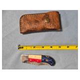 Lockback knife w/red, white, blue wood handle.