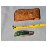 Folding knife w/wood handle. Damascus steel.