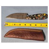 Straight blade knife w/jimping on spine.