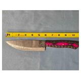 Drop point blade knife. Carved wood handle.