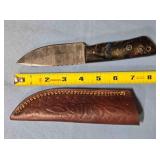 Drop point blade knife w/jimping on spine.