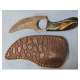 Trailing point knife w/finger hole in blade.