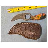 Trailing point knife w/finger hole in blade.