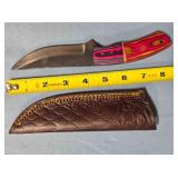 Straight blade knife w/two tone wood handle.