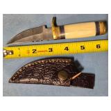 Straight blade knife w/jimping on spine.