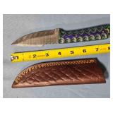 Straight blade hunting knife w/jimping on blade.