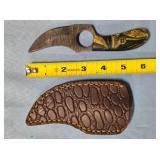 Trailing point knife w/jimping on handle.