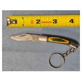 Folding knife w/keychain. Wood handle.