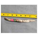 Folding knife w/composite handle. Damascus steel.